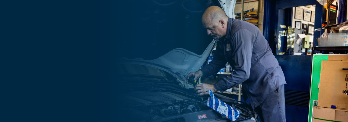 man working on car